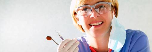 Dental hygienist with dental tools